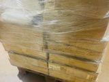a large pile of cardboard sitting on top of a pallet