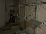 an image of a room with a bunch of shelves and wires