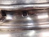 a silver plate with a bird on top of it