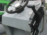 a truck with a steering wheel on the side of the road