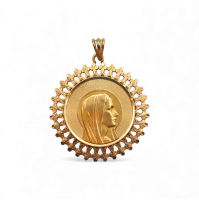 a close up of a gold medal with a woman ' s face on it
