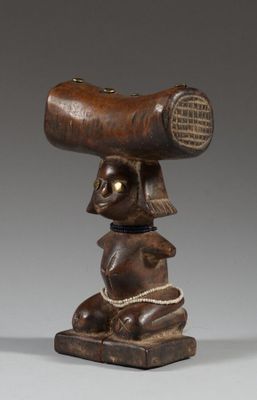 an image of a wooden sculpture of a man holding a large piece of wood