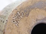 a close up of a vase with writing on it