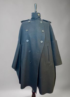 an image of a blue coat on a mannequin stand