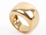 a close up of a gold ring on a white background