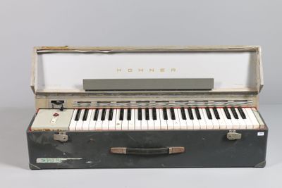 a black suitcase with a piano inside of it