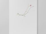 a piece of white paper with a single red flower on it