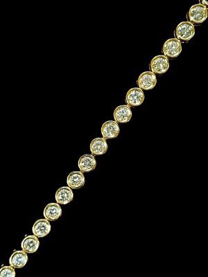 Bracelet ligne en or jaune 18K (750/oo) composé de 28 maillo…