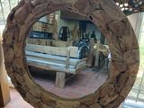 a mirror that is sitting on a table in a room