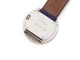 an image of a close up of a watch on a white surface