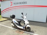 a scooter that is parked in a parking lot