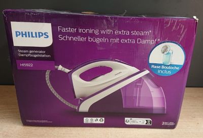 packaging of a philips steam iron sitting on a wooden table