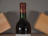a bottle of wine that is sitting on a table