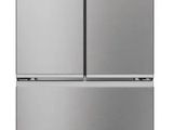 a silver refrigerator freezer sitting on top of a white surface