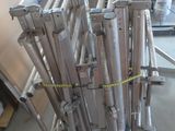 a lot of metal pipes that are stacked on top of each other