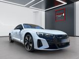 a white audi sports car parked in a showroom
