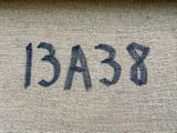 the word peace is written in black ink on a burlock cloth