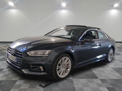 the audi s4 is parked on a checkered floor in a showroom