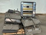 a pile of old electronic equipment sitting on a pallet