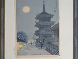painting of a pagoda in the snow with a person holding an umbrella