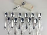 a lot of spoons that are sitting on a table