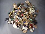 a pile of assorted brooches and brooches on the floor