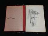 an open book with a picture of a house on it