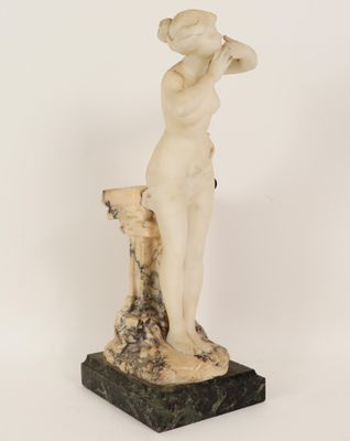 an image of a statue of a woman standing on a marble base
