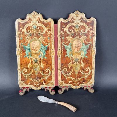 pair of antique painted wooden doors with a knife on a stand