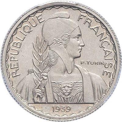 a close up of a coin with a woman on it