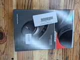 a box of headphones sitting on a wooden table