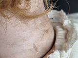 a close up of a doll ' s neck with a frilly around it