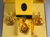 a yellow box with two bottles of perfume in it