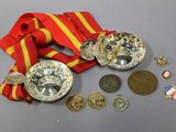 a medal, a medal, and a medal on a table
