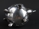 an image of a silver object on a black background