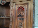 a large wooden cabinet with carvings on it