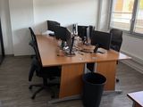 an image of an office with two computers on a desk