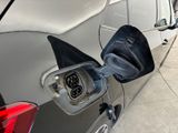 a car that has a gas pump attached to it ' s side