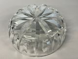 a clear glass bowl with a decorative design on it
