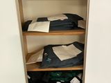 a closet full of clothes and other items in it