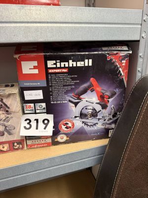 a box of electric tools on a shelf in a store