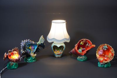 a lamp that is sitting next to a bunch of figurines