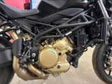 a close up of a motorcycle parked in a garage