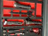 many tools in a tool box on the shelf