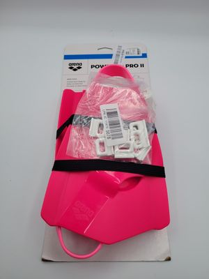 a close up of a pink bag on a white surface