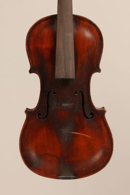 an old violin with a wooden bow hanging from it ' s back