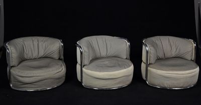 three chairs are lined up in a row on a black background