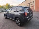 the rear end of a grey dacia parked in a parking lot