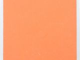 an orange book with chinese writing on the cover