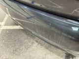 a close up of a car ' s bumper with a sticker on it
